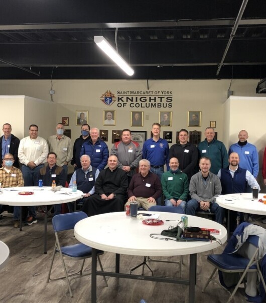 group of men at front of room